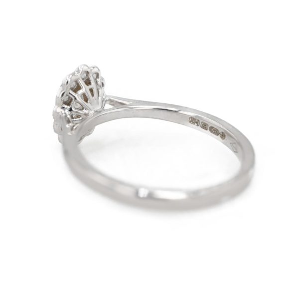 Bague marguerite ovale diamants serti feston