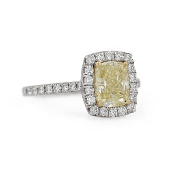 Bague marguerite diamant jaune entourage diamants blancs
