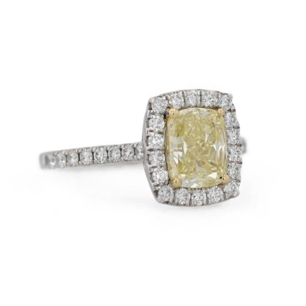 Bague marguerite diamant jaune entourage diamants blancs