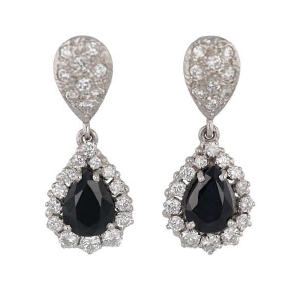 Boucles d'oreilles pendantes saphir entourage diamants en or blanc 18 carats